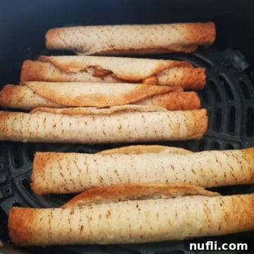 Perfectly Crispy Frozen Taquitos in the Air Fryer 6 air fried taquitos in the air fryer basket