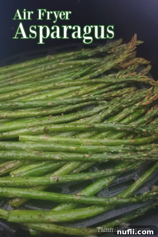 Air-Fried Asparagus 2 Air fried asparagus stalks in an air fryer basket, ready to be served