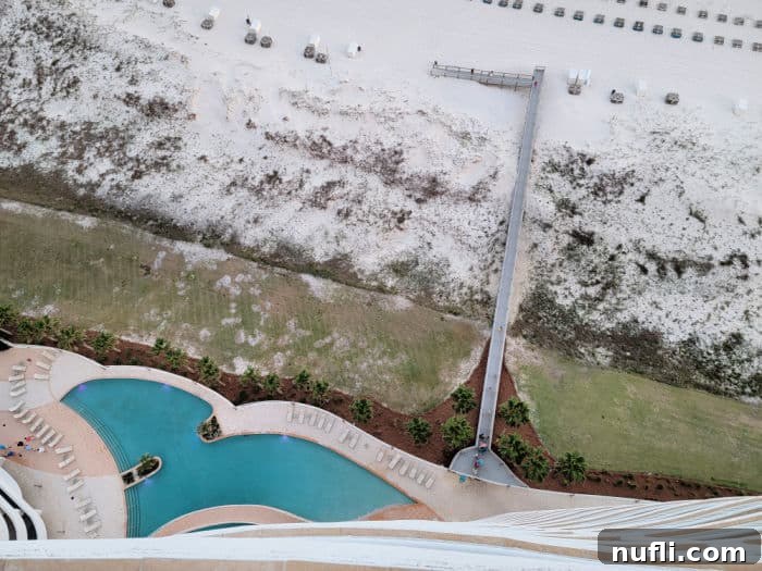 Turquoise Place: Orange Beach Alabama's Luxury Gulf Resort 16 Looking down to the pool, wooden boardwalk over the sand dunes, and white sand