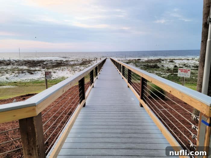 Turquoise Place: Orange Beach Alabama's Luxury Gulf Resort 17 Wooden boardwalk over the sand dunes to the Gulf of Mexico in the distance.