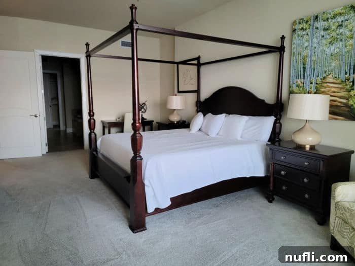 Turquoise Place: Orange Beach Alabama's Luxury Gulf Resort 10 four poster bed with white linens, nightstand and chair