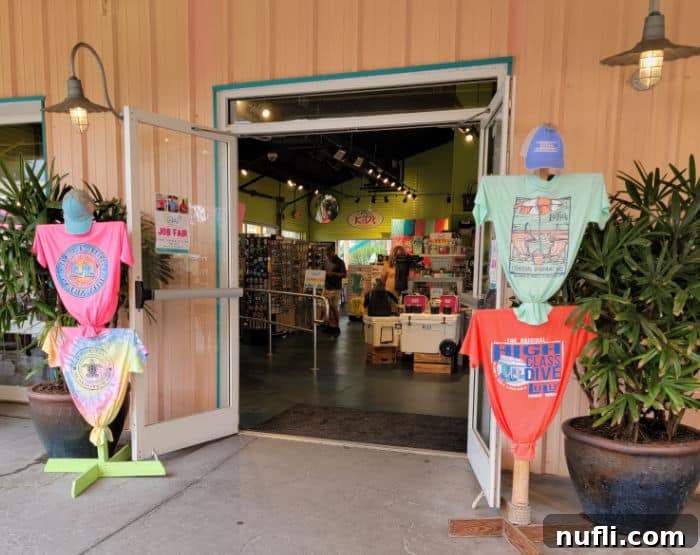 The welcoming entrance to LuLu's gift shop, adorned with displays of t-shirts and souvenirs, inviting visitors to take a piece of LuLu's home.