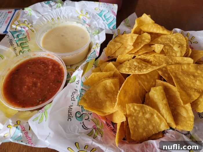 LuLu's tortilla chips with salsa and a side of creamy white queso, a popular appetizer at the Gulf Shores restaurant.