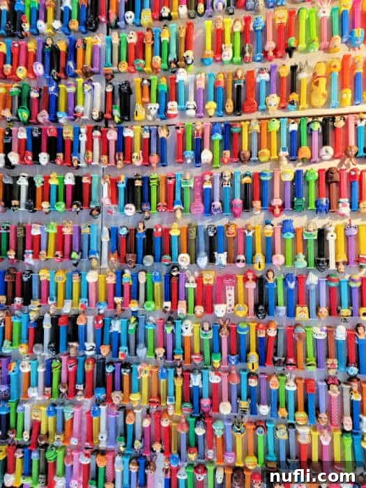 Pez dispensers lined up on a wall