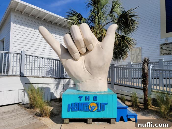 Giant Shaka hand statue with 'The Hangout' printed below it