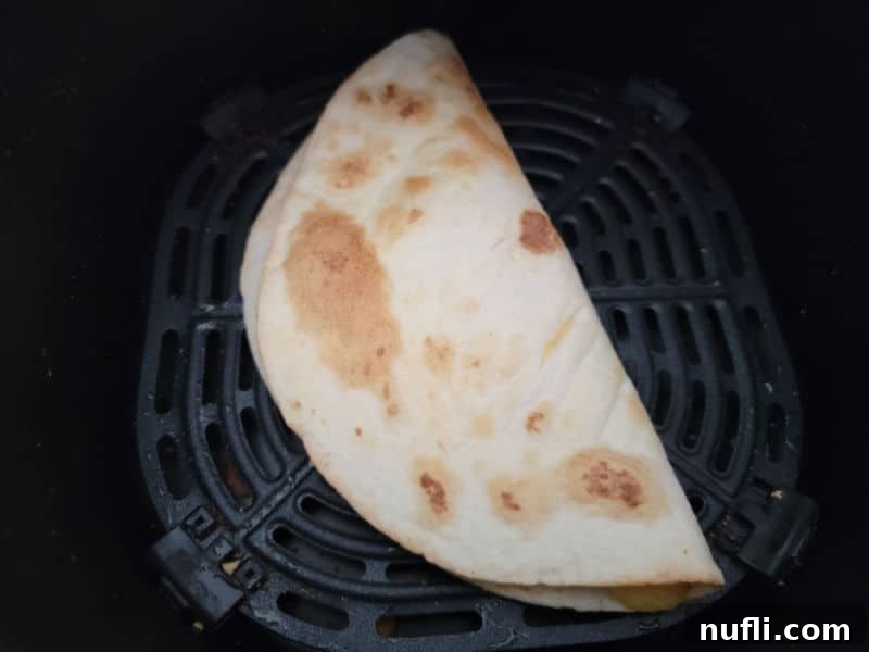Crispy Air Fryer Quesadillas 6 Air Fryer Quesadilla in the air fryer basket