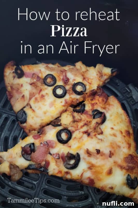 How to Reheat Pizza in Air Fryer over two slices of pizza in the air fryer basket