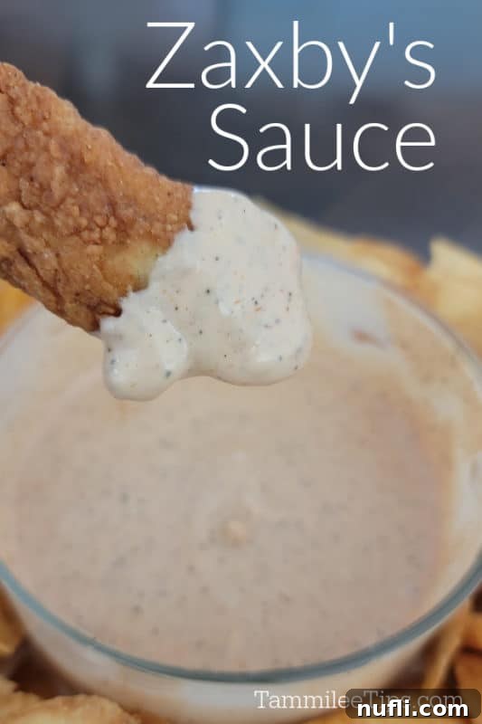 Zaxby's Sauce over a chicken tender dipped in sauce and a glass bowl