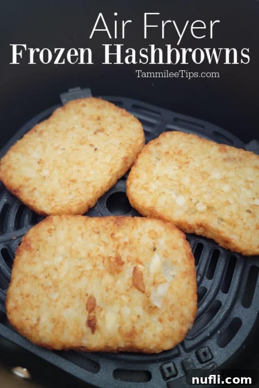 Air Fryer frozen hashbrowns over three hashbrown patties in the air fryer basket