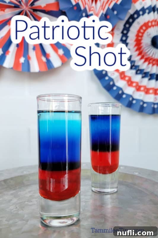 Patriotic red, white, and blue layered shots arranged on a silver serving platter, ready for celebration.