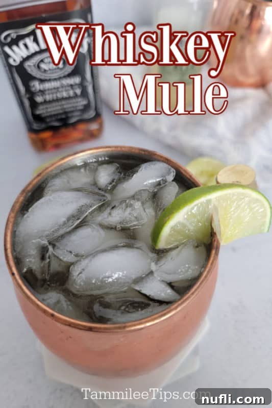 Whiskey Mule text over a copper mug with drink in it and a bottle of Jack Daniels Whiskey in the background