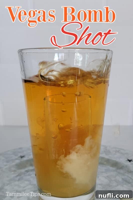 Vegas Bomb shot over a glass with a shot glass in it
