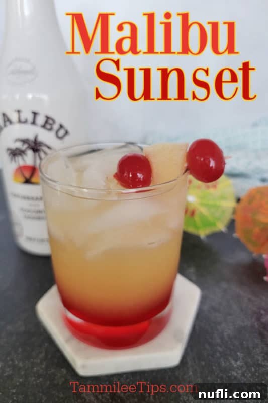 A vibrant Malibu Sunset cocktail showing orange and red layers, garnished with cherries and a pineapple chunk, with a bottle of Malibu Rum in the background.