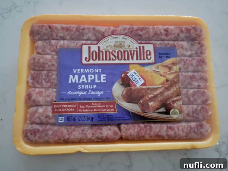 Crispy Air Fryer Sausages 3 An unopened package of Johnsonville Maple Syrup breakfast sausages, highlighting the brand and flavor for recipe selection.