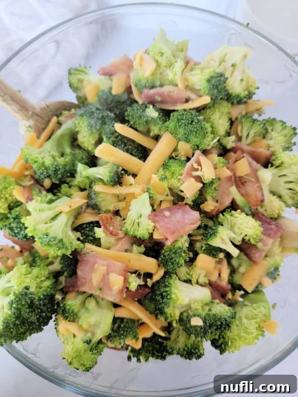 Loaded Broccoli Bacon Salad 4 Broccoli salad with bacon and cheese in a glass bowl
