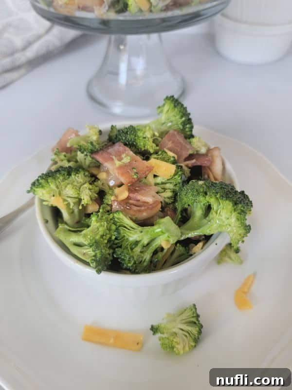 Loaded Broccoli Bacon Salad 5 Broccoli salad with bacon in a white bowl