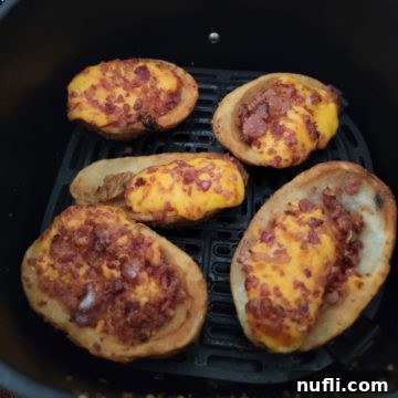 air fried frozen potato skins in an air fryer basket