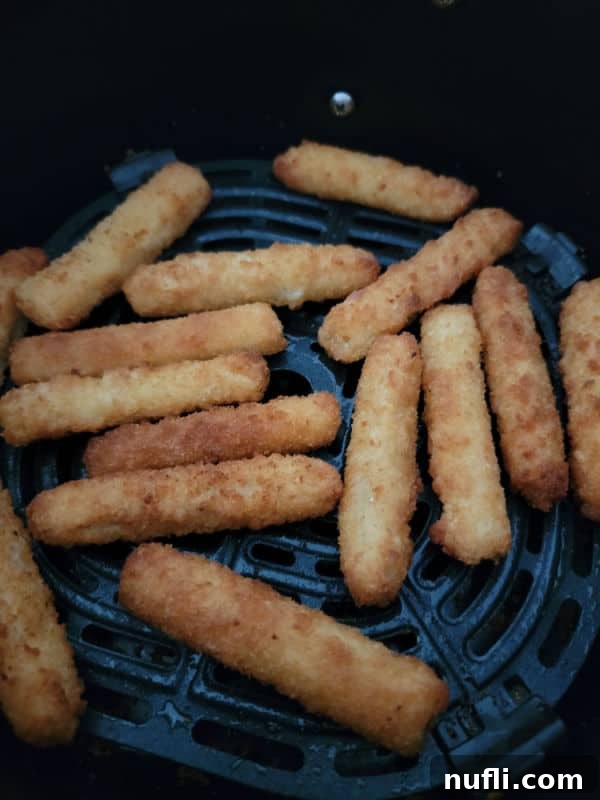Air fried fish sticks in the air fryer basket