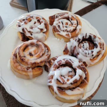 Air Fryer Cinnamon Rolls on a white plate