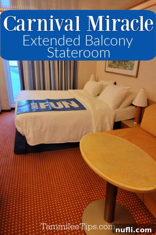 Carnival Miracle Extended Balcony Stateroom text in a blue box above a bed with a choose fun mat on it, round table next to a couch, and picture on the wall