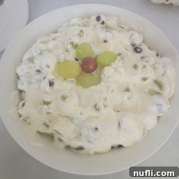 Grape salad with green and red grapes in a white bowl