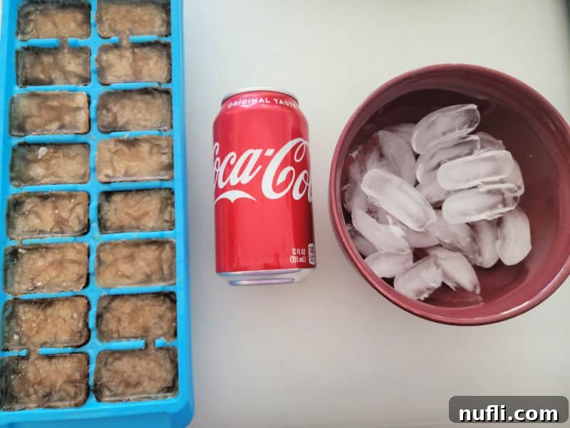 Coke ice cubes, can of Coca Cola, and bowl of ice cubes