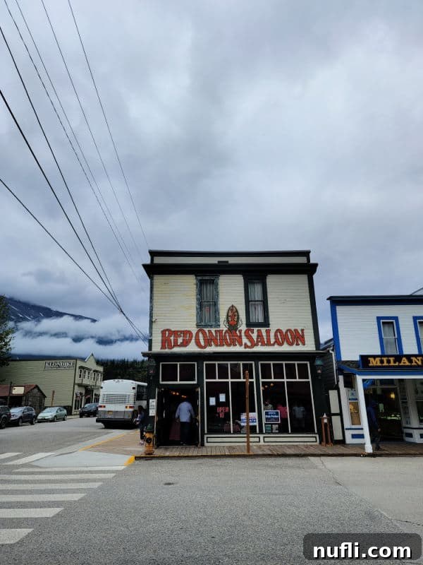 Red ONion Saloon next to other buildings in Skagway 