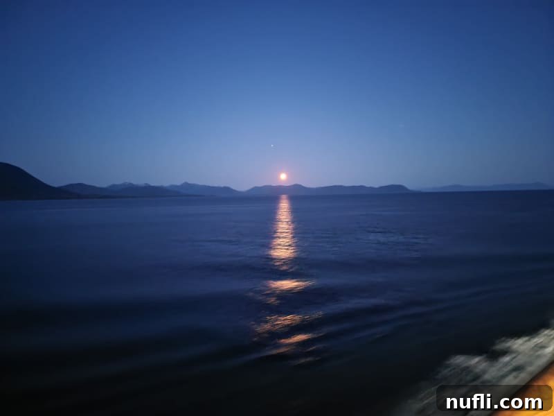 Moon glow over the water from the Carnial Miracle Cruise Ship 