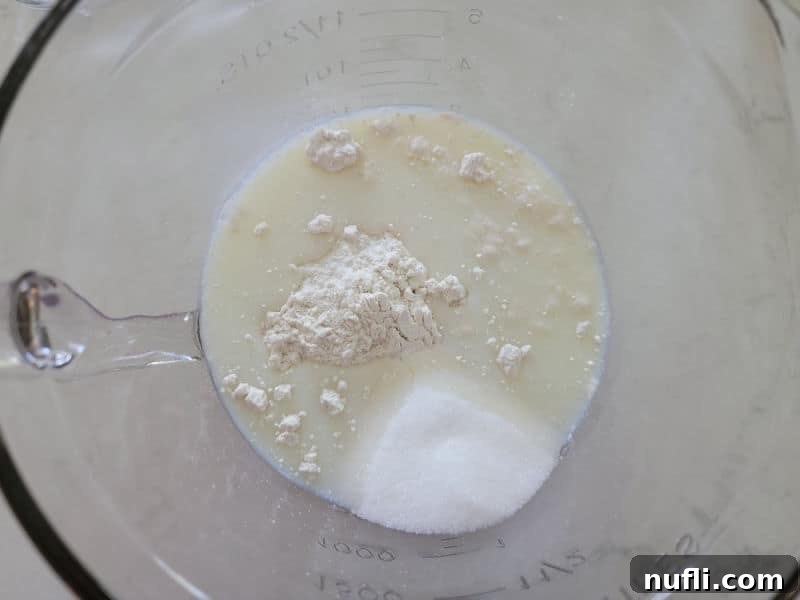 Milk with dry ingredients in a glass bowl 