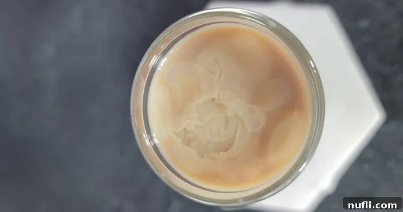 Looking down on a cement mixer shot on a white coaster