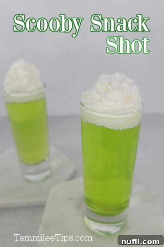 Easy Scooby Snack Shot Recipe 2 Scooby Snack Shot text over two green cocktail shots with whipped cream garnish