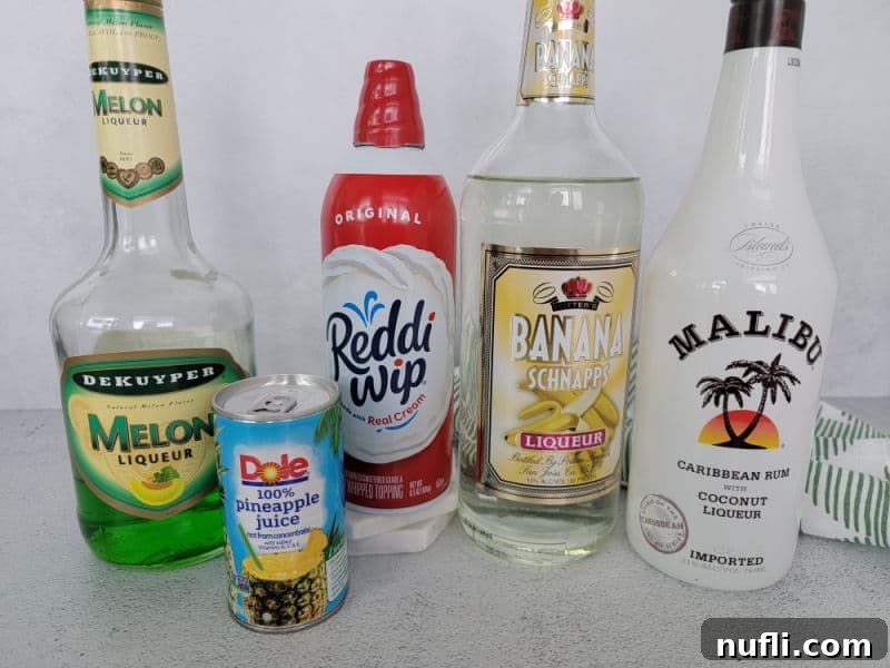 Easy Scooby Snack Shot Recipe 3 Scooby Snack Shot ingredients Melon Liqueur, Pineapple Juice, whipped cream, banana schnapps, and malibu coconut rum