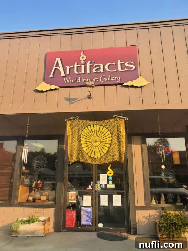 Artifacts world import gallery sign over a tapestry hanging over the front door