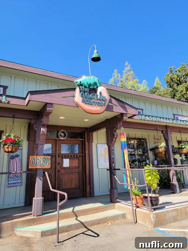 Unlocking North Fork California 10 The Gnarly Carrot entrance with a carrot sign, wooden doors, and an open sign, inviting customers.
