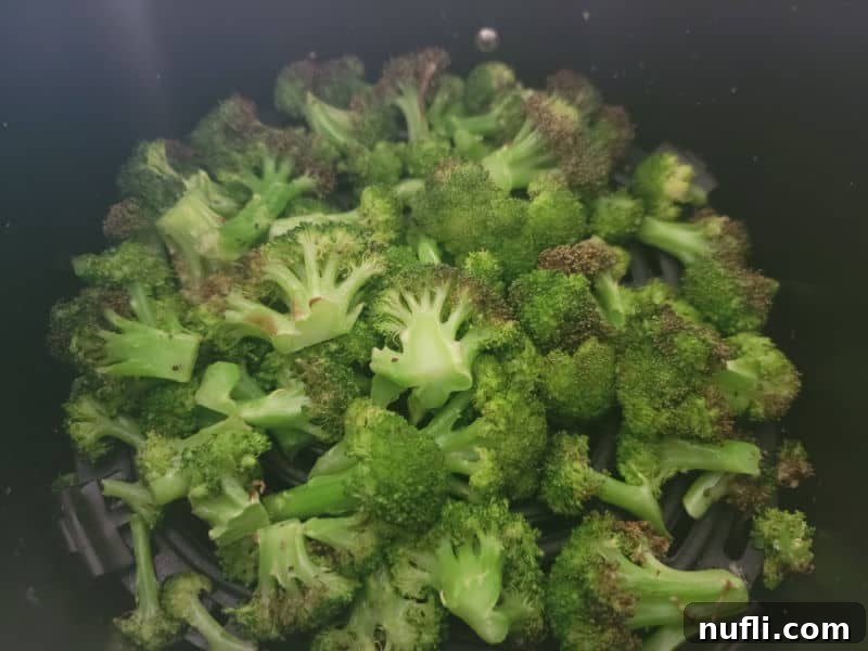 Air fried broccoli in the air fryer basket