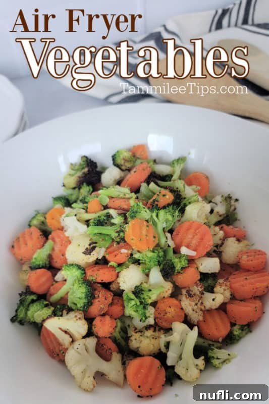 Crispy air fryer frozen vegetables served on a plate with a mix of broccoli, cauliflower, and carrots.