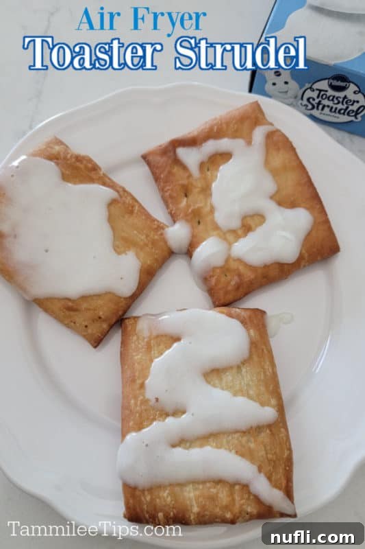 Golden Air Fryer Toaster Strudels 2 Crispy golden Air Fryer Toaster Strudel on a white plate, drizzled with icing.