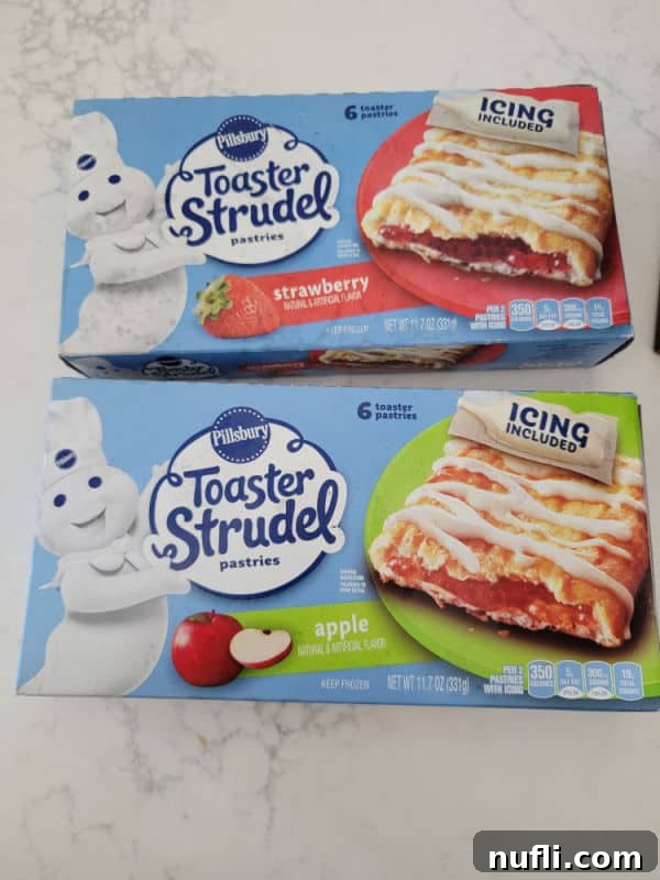 Golden Air Fryer Toaster Strudels 3 Two packages of Pillsbury Toaster Strudel, ready for air frying.