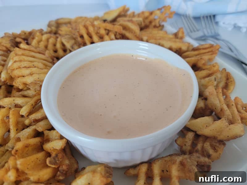 Comeback Sauce in a white bowl surrounded by waffle fries