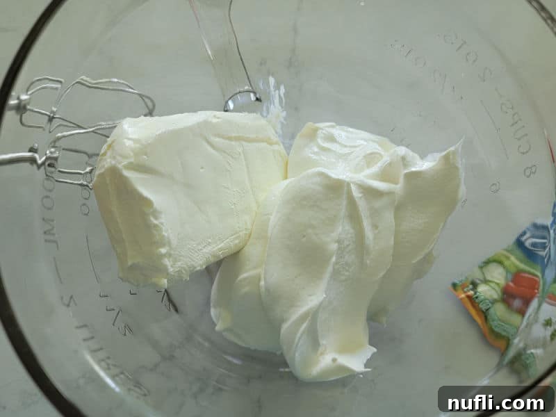 Simple 3-Ingredient Creamy Hidden Valley Ranch Dip 4 cream cheese and sour cream in a glass bowl