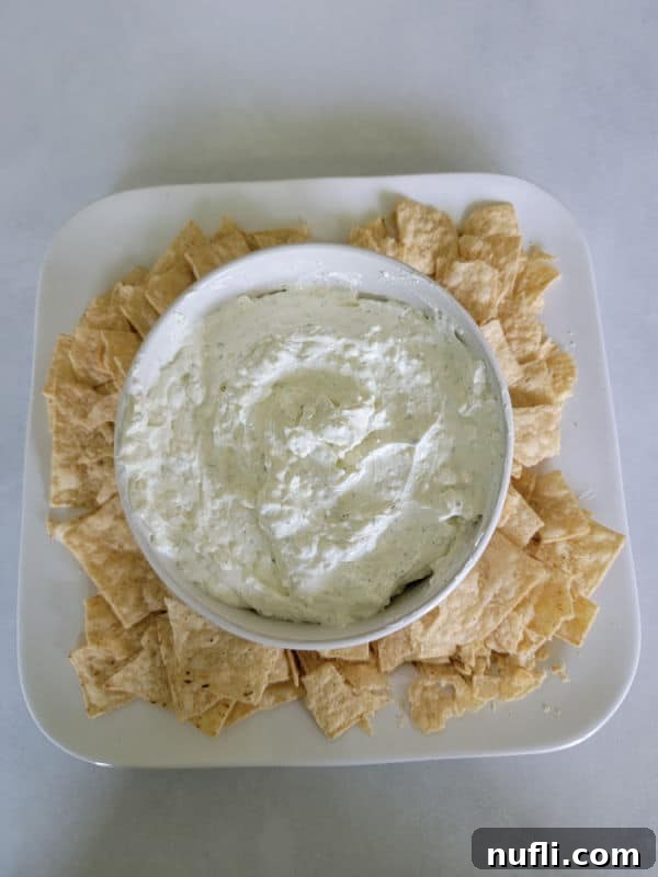 Simple 3-Ingredient Creamy Hidden Valley Ranch Dip 8 Ranch dip in a white bowl with tortilla chips on a white plate