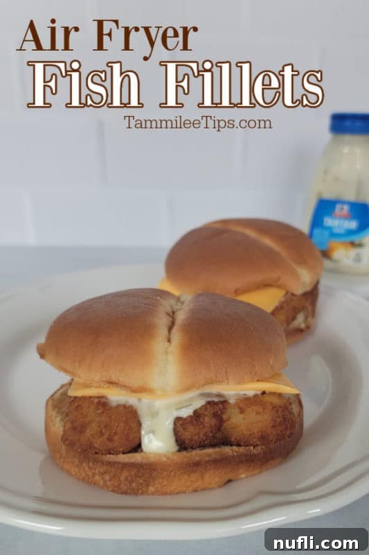 Air Fryer Fish Fillets over two fish sandwiches and a jar of tartar sauce in the background
