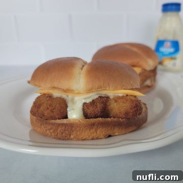 air fried fish fillet sandwich on a white plate