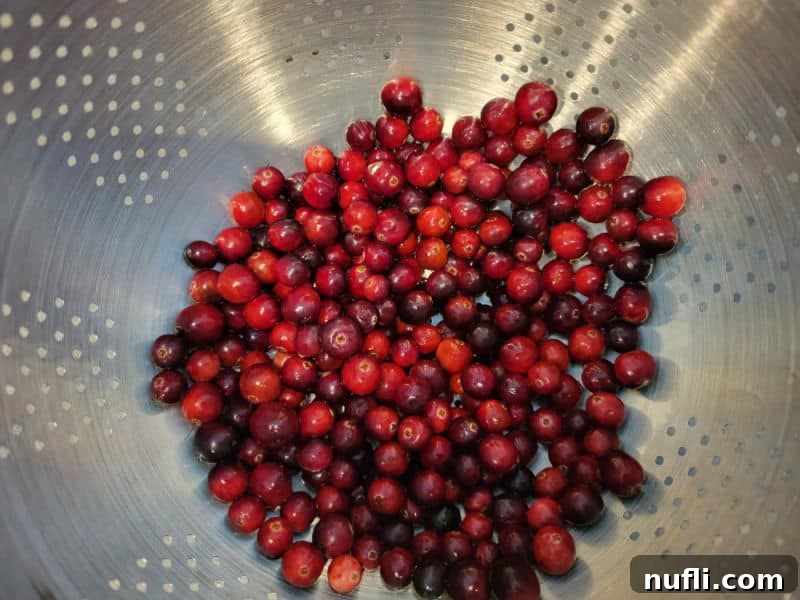Quick and Easy Cranberry Fluff Salad 4 Fresh cranberries in a colander for cranberry salad