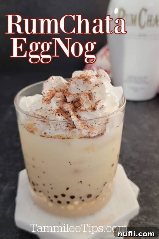 A festive RumChata Eggnog Cocktail, garnished with fluffy whipped cream and a sprinkle of ground cinnamon, presented in a clear glass. A bottle of RumChata stands elegantly in the background, hinting at the key ingredient.