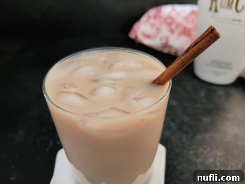 Creamy RumChata Iced Coffee Bliss 5 Iced Coffee RumChata in a clear glass next to a bottle of RumChata