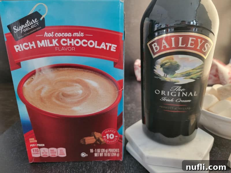 Effortless Baileys Hot Chocolate 3 Baileys Hot Chocolate ingredients, hot cocoa mix and a bottle of Baileys Original Irish Cream