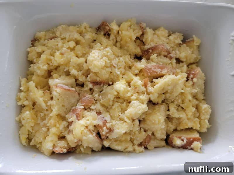 Effortless 5 Ingredient Pineapple Stuffing 8 pineapple stuffing in a white baking dish before baking