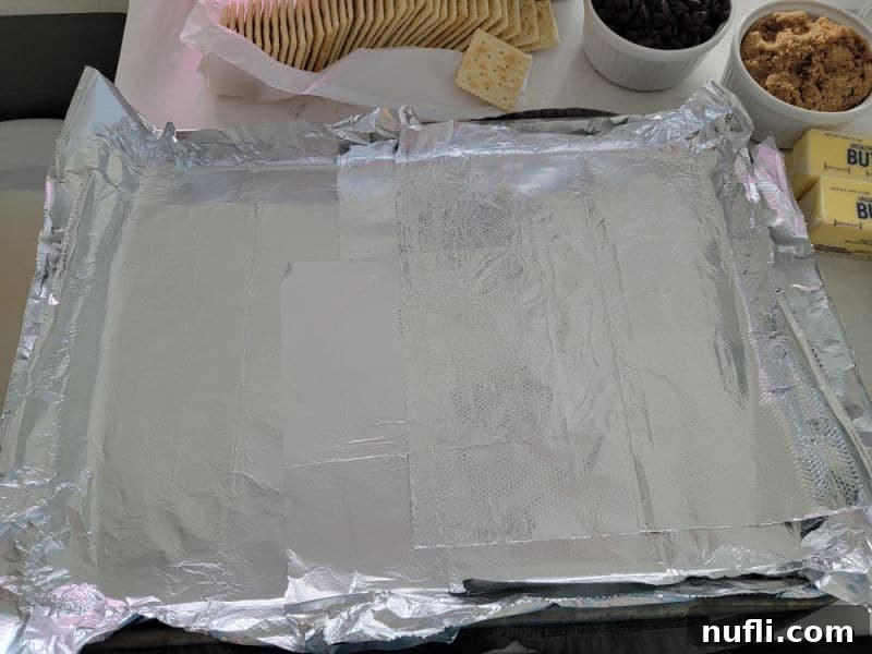 Irresistible 4 Ingredient Christmas Crack 4 Aluminum foil lined baking dish for Christmas Crack