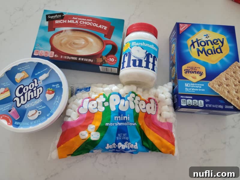 Hot Cocoa Dip ingredients, hot chocolate, cool whip, marshmallow fluff, mini marshmallows, and graham crackers